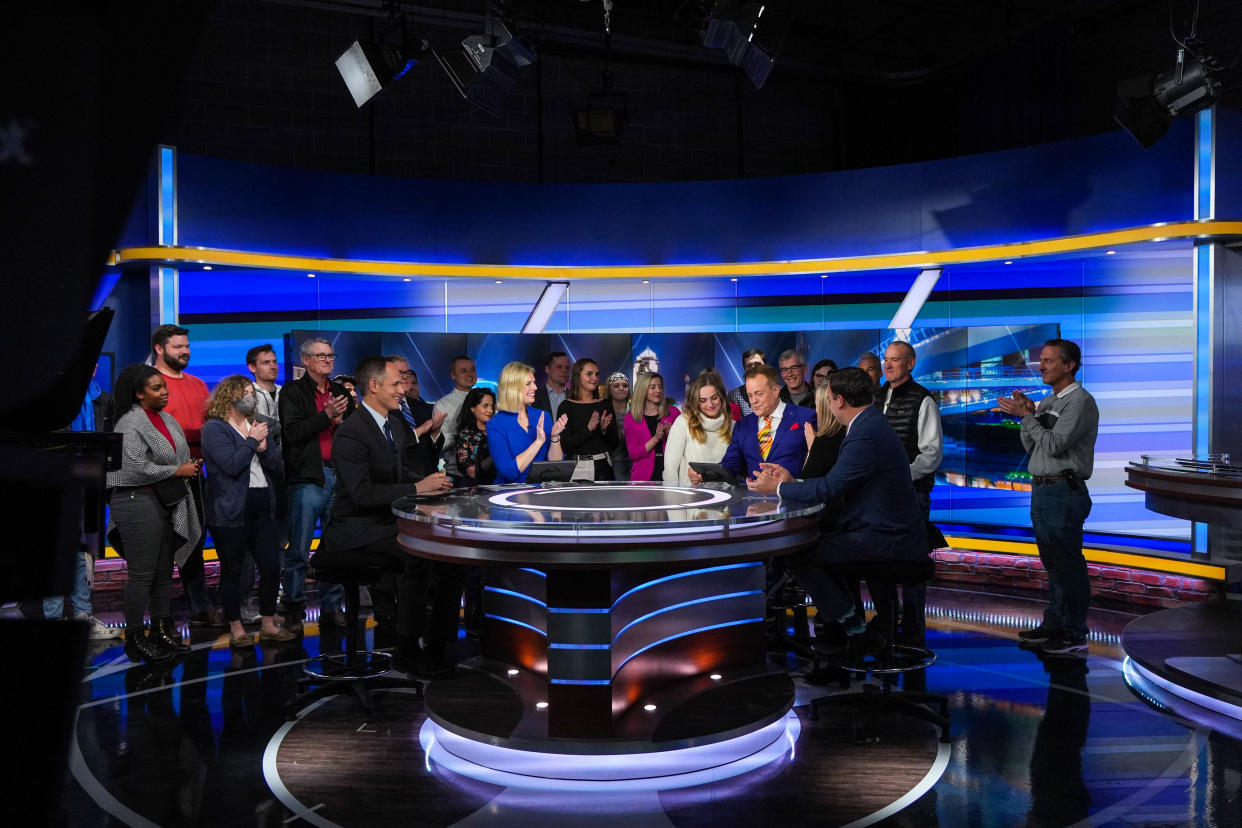 KCCI nightly news anchor Steve Karlin is surround by family, friends, and coworkers after his last new report after 34 years at the station in Des Moines on Wednesday, March 1, 2023.