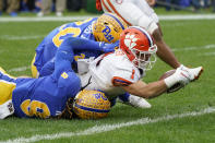 Clemson running back Will Shipley (1) is down by Pittsburgh defensive back Brandon Hill (9) and linebacker Wendell Davis (20) as he stretches for the goal line during the first half of an NCAA college football game, Saturday, Oct. 23, 2021, in Pittsburgh. (AP Photo/Keith Srakocic)