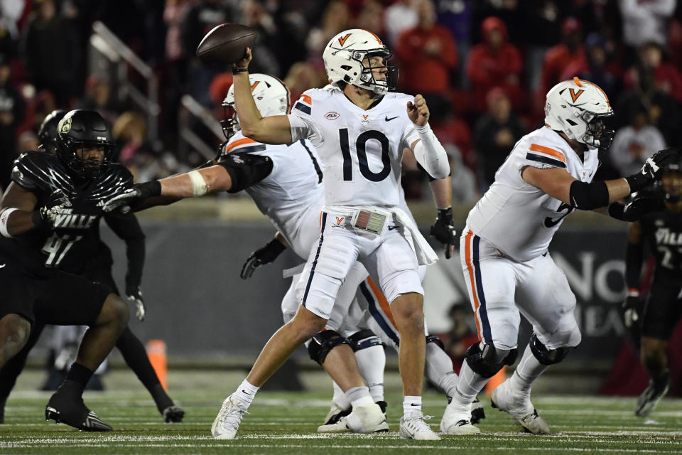 Virginia quarterback Anthony Colandrea (10), attempts a pass during the second half of an NCAA college football game against Louisville in Louisville, Ky., Thursday, Nov. 9, 2023. (AP Photo/Timothy D. Easley)