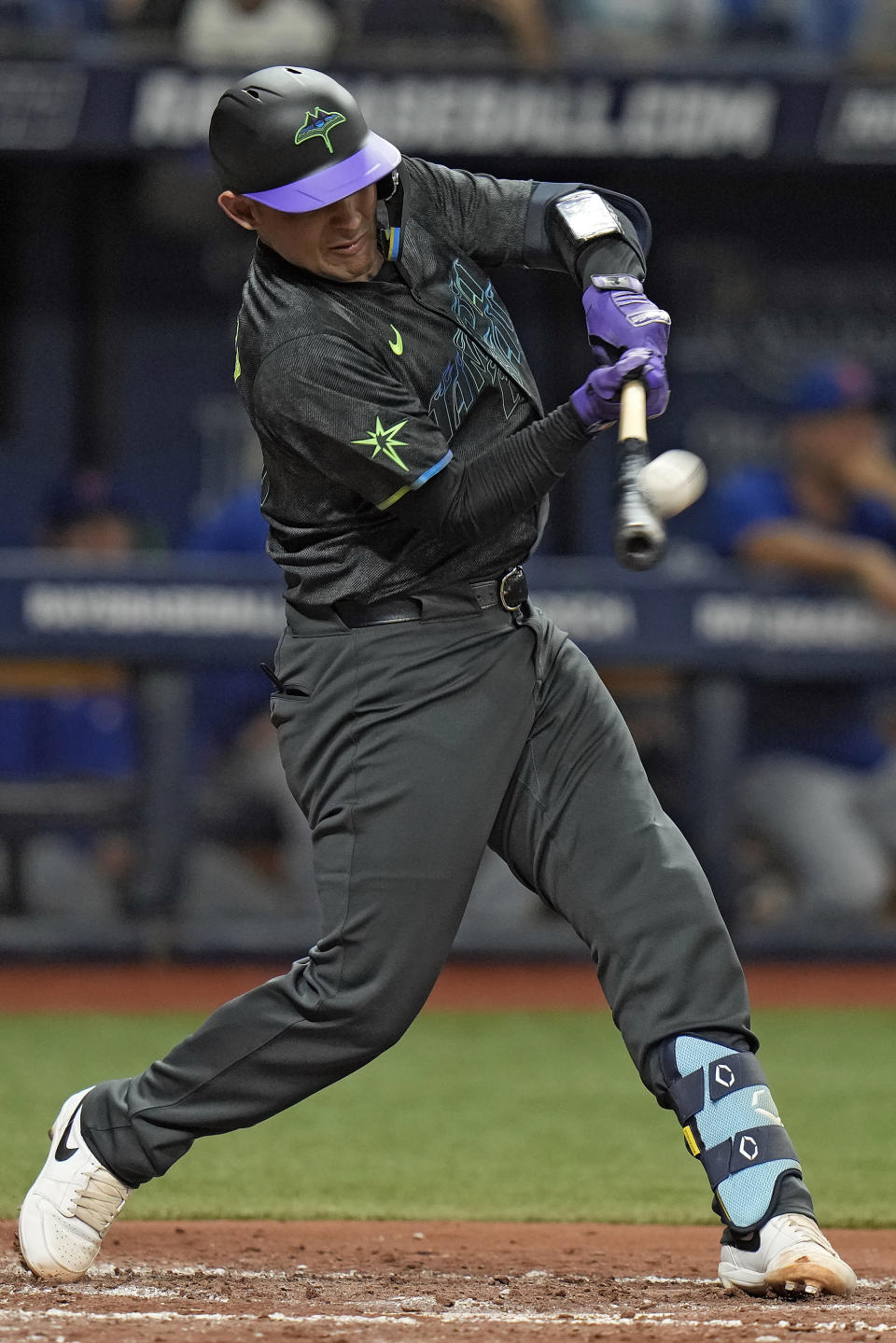 Tampa Bay Rays' Alex Jackson connects for a run scoring sacrifice fly off New York Mets starting pitcher Jose Quintana during the third inning of a baseball game Friday, May 3, 2024, in St. Petersburg, Fla. Rays' Randy Arozarena scored on the play. (AP Photo/Chris O'Meara)