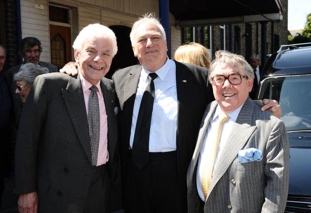 Barry Cryer, Roy Hudd and Ronnie Corbett leave the funeral of Danny La Rue (Ian West/PA)