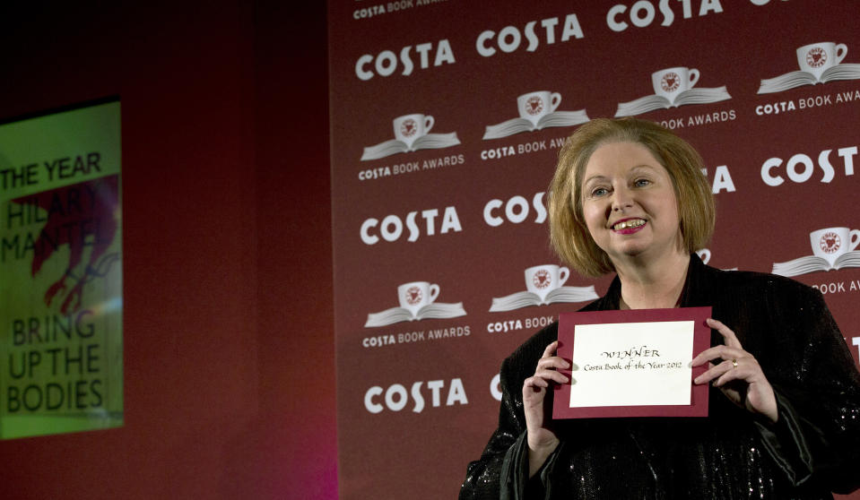 FILE - Author and winner of the Costa Book of the Year Award for 2012 Hilary Mantel poses for photographers at the Costa Book awards ceremony in London, on Jan. 29, 2013. Hilary Mantel, the Booker Prize-winning author of the acclaimed “Wolf Hall” saga, has died, publisher HarperCollins said Friday Sept. 23, 2022. She was 70. (AP Photo/Alastair Grant, File)