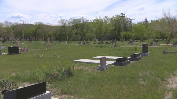 The Cowessess First Nation says it has found hundreds of unmarked graves at the former Marieval Indian Residential School gravesite. There are already also some marked graves at the site. (CBC - image credit)