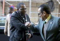 Equatorial Guinea's Mines and Hydrocarbons Minister Gabriel Mbaga Obiang Lima, left, greets an employee of OPEC with his elbow during his arrival for a meeting of the Organization of the Petroleum Exporting Countries, OPEC, at their headquarters in Vienna, Austria, Thursday, March 5, 2020. (AP Photo/Ronald Zak)