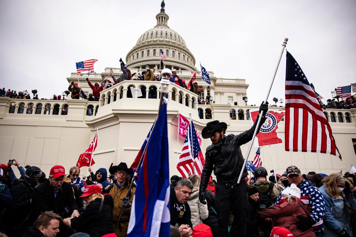 Trump supporters storm the U.S. Capitol following a rally with President Donald Trump on Jan. 6. At his Senate impeachment trial, only seven members of the GOP voted to convict Trump of inciting the insurrection. (Photo: Samuel Corum/Getty Images)