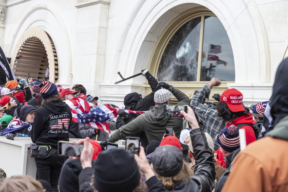 Pro-Trump protesters break windows of the Capitol building. (Lev Radin / Pacific Press / LightRocket via Getty Images file)