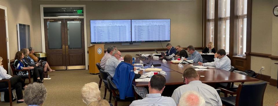 The Montgomery County Commission's Budget Committee goes over the numbers in a recent session at the courthouse