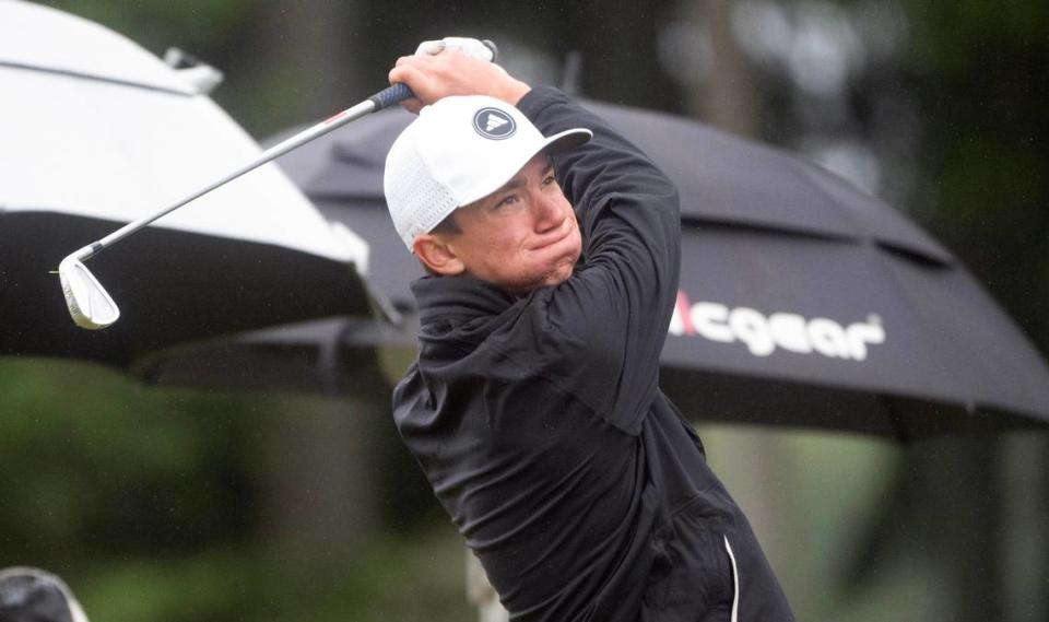 Capital’s Eli McNelly tees off on the par 3 16th hole during the opening day of the 3A Boys Golf State Championships at The Golf Club at Hawks Prairie in Lacey, Washington, on Tuesday, May 21, 2024.