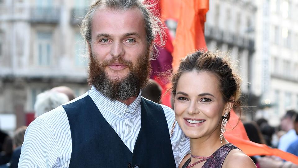 Kara Tointon cradles her baby bump in a pink maxi dress with Marius