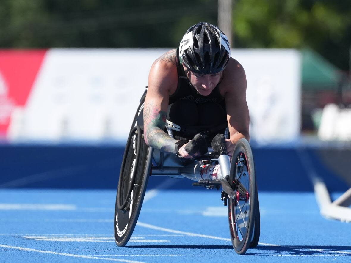 Jessica Frotten, of Whitehorse, races to a first place finish in the 1,500-metre para wheelchair final at the Canadian Track and Field Championships in Langley, B.C., on Friday.  (Darryl Dyck/The Canadian Press - image credit)