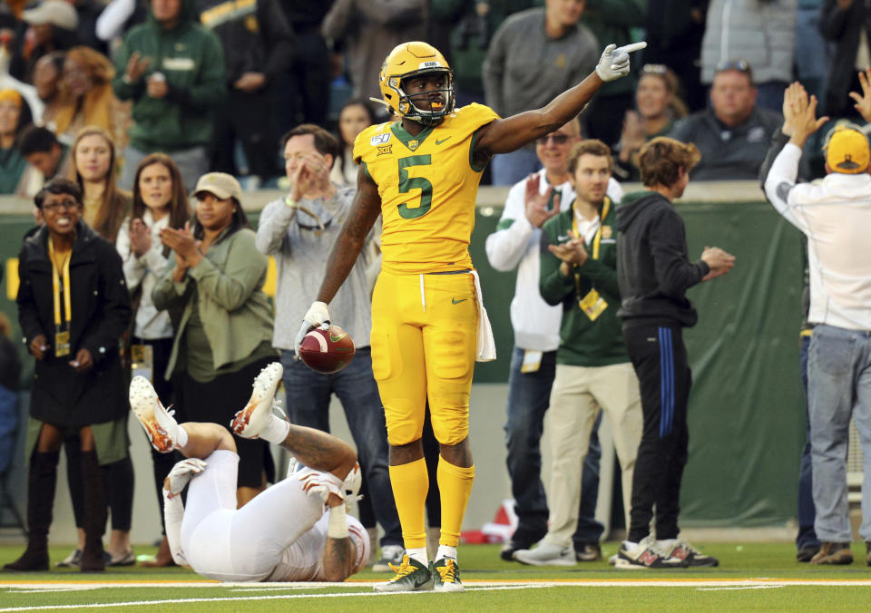 Baylor wide receiver Denzel Mims (5) makes a first-down gesture in the fourth quarter against Texas in an NCAA college football game Saturday, Nov. 23, 2019, in Waco, Texas. (AP Photo/Richard W. Rodriguez)