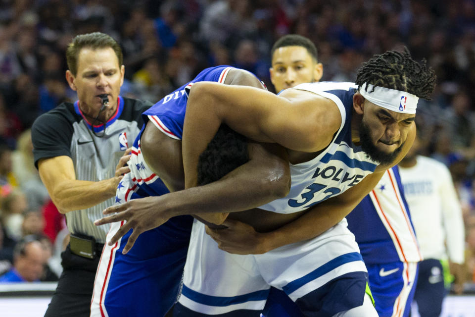 Joel Embiid #21 of the Philadelphia 76ers gets in a fight with Karl-Anthony Towns #32 of the Minnesota Timberwolves. (Credit: Getty Images)