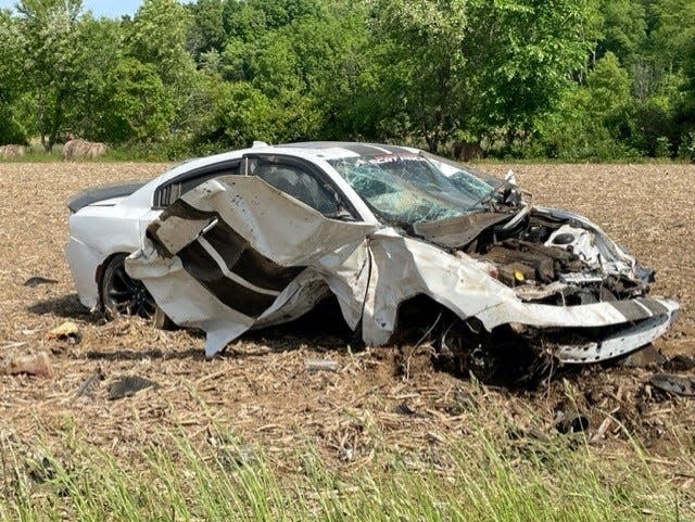 A stolen Dodge Charger is shown after it crashed Thursday on U.S. Route 36 east of Robin Road in Clay Township. The car was traveling up to 163 mph, according to Tuscarawas County Sheriff Orvis Campbell.