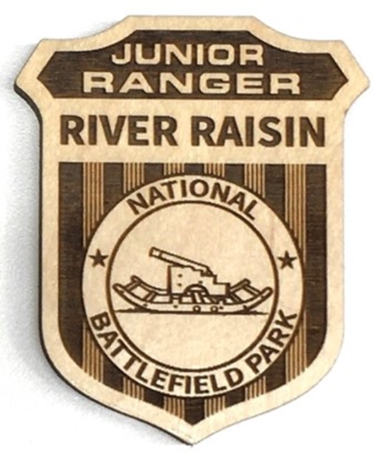 The River Raisin National Battlefield Park's newly redesigned Junior Ranger badge is shown. Residents can earn the badge by completing activities.