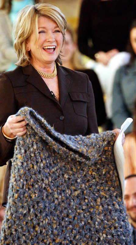 Martha Stewart shows on March 7, 2005, a poncho that was crocheted and given to her by a fellow inmate at Alderson federal prison when Martha left on March 4, 2005. File Photo by Ezio Petersen/UPI