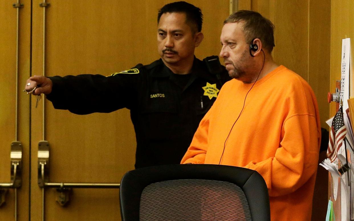 Andrew Warren, right, enters a courtroom for an extradition hearing at the Hall of Justice in San Francisco - AP