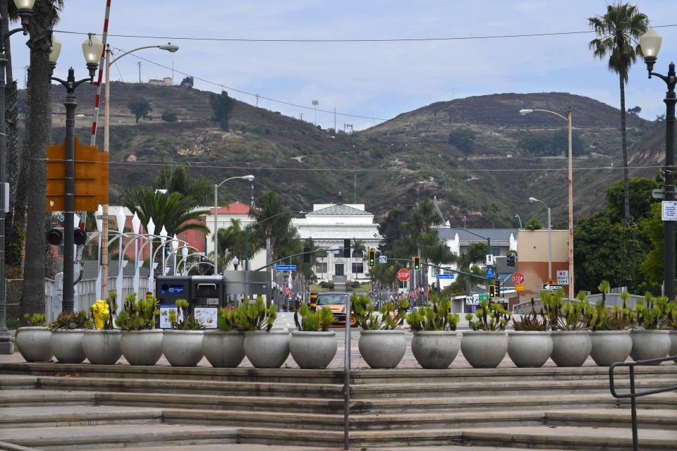 The Ventura foothills tower over California Street from the Promenade on July 17.