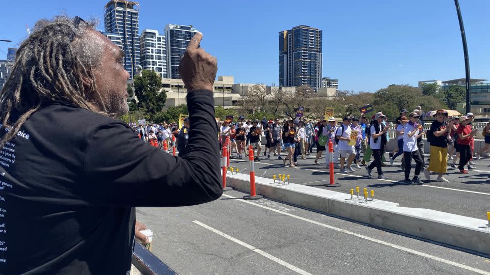 Aboriginal activist Wayne Wharton delivers his message to supporters at the "Walk for Yes" rally in Brisbane on Sunday, September 17. - Hilary Whiteman/CNN
