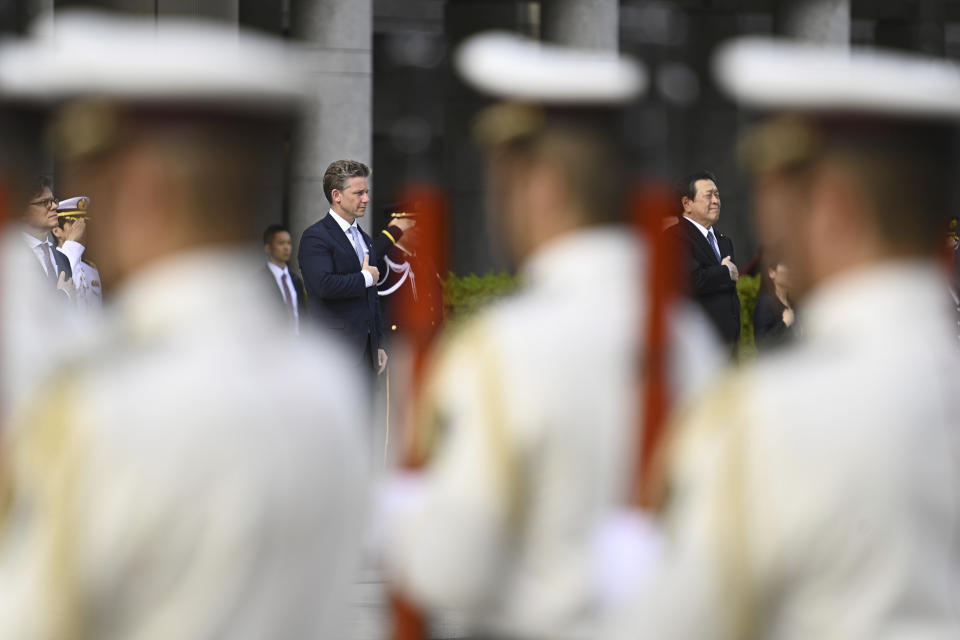 Sweden's Defense Minister Pal Jonson, center left, reviews an honor guard, with Japanese Defense Minister Yasukazu Hamada, right, ahead their bilateral meeting at the Defense Ministry Wednesday, June 7, 2023, in Tokyo, Japan. (David Mareuil/Pool Photo via AP)