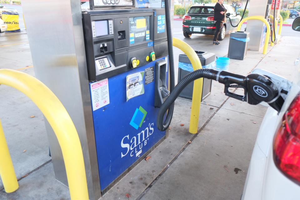 Citrus Heights, California, USA - December 12, 2016:  Pumping gas at the  Sam's club gas station located at 7147 Greenback Ln in Citrus Heights, California. Sam's club is a members only wholesale warehouse offering name brand products at a discounted rate.