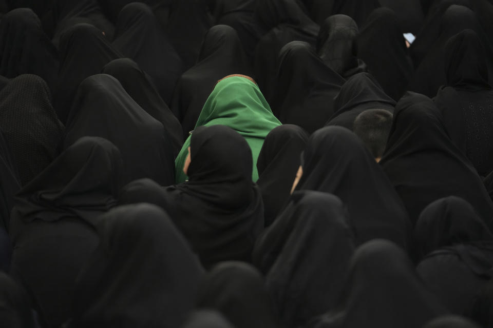 Women attend the Ashoura mourning ritual, Friday, July 28, 2023, in Tehran, Iran. Millions of Shiite Muslims around the world on Friday commemorated Ashoura, a remembrance of the 7th-century martyrdom of the Prophet Muhammad's grandson, Hussein, that gave birth to their faith. (AP Photo/Vahid Salemi)