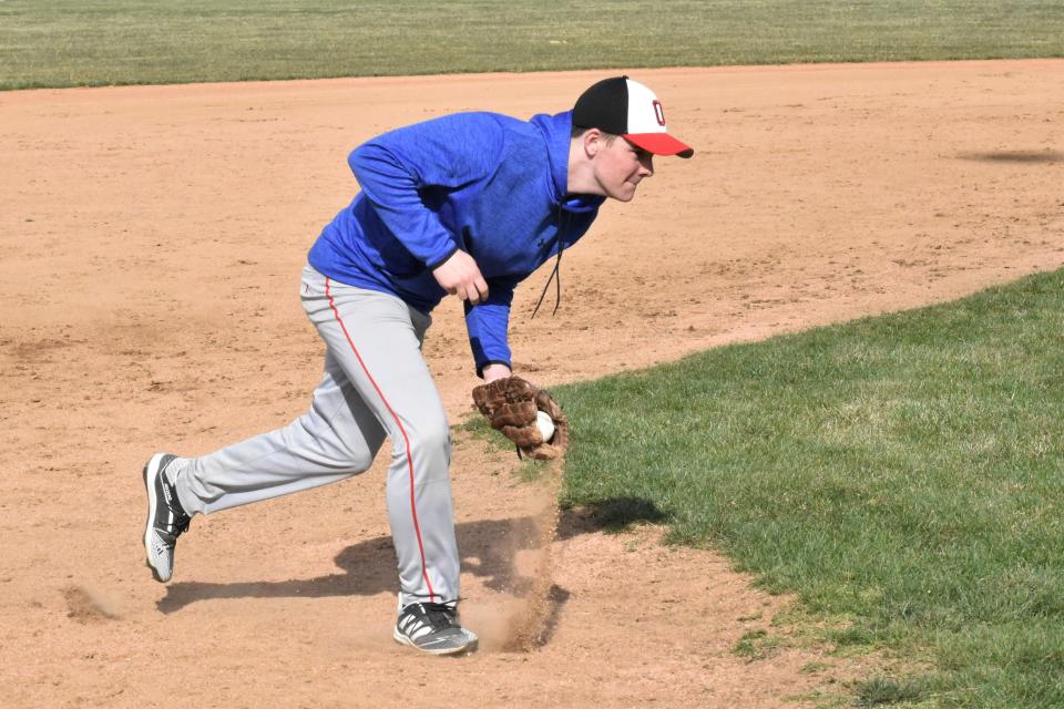 Bryce Berning scoops a ground ball out of the dirt during a preseason practice.