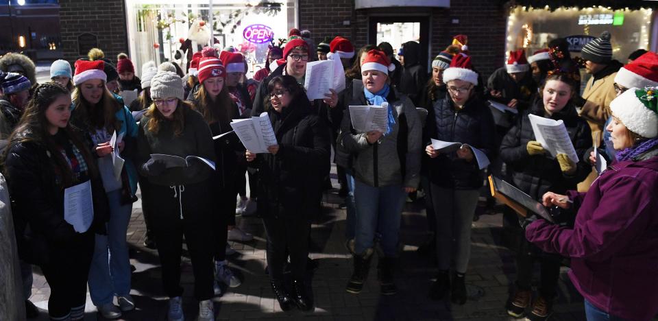 The Nevada High School choir sings Christmas carols while participating in Nevada's Christmas on Main on Saturday, Dec. 11, 2021, in Nevada, Iowa.