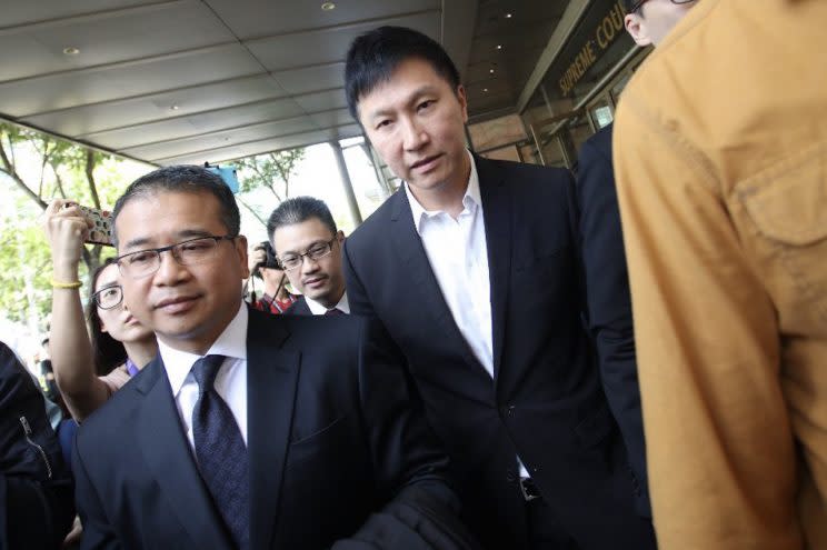 City Harvest Church founder Kong Hee (right) leaving the Supreme Court building after the verdict in the CHC appeal was announced on 7 April 2017. (Photo: Don Wong/Yahoo Singapore)