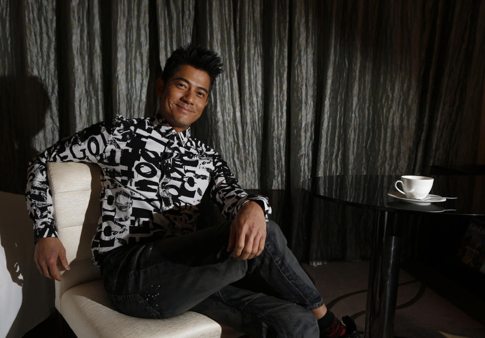 In this Friday, Jan. 10, 2014 photo, Hong Kong veteran actor and performer Aaron Kwok poses during an interview in Hong Kong. Aaron Kwok says he brought out a softer side of a classic villain, the Bull Demon King. Kwok plays the character in the new 3-D fantasy film, "The Monkey King." He joins a stellar ensemble cast that includes other A-listers like Donnie Yen, Chow Yun Fat, and Kelly Chan. (AP Photo/Kin Cheung)