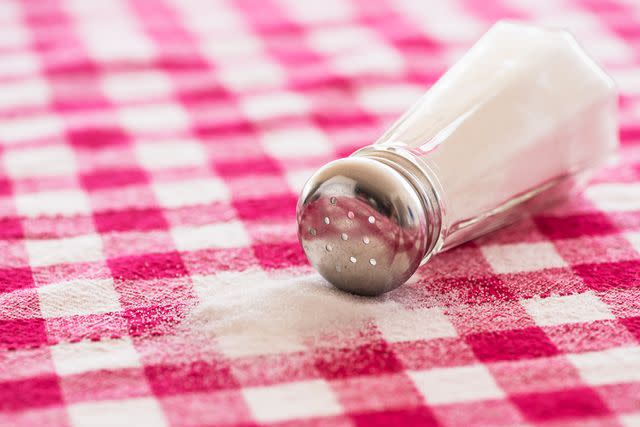 <p>Getty</p> Stock image of a spilled salt shaker.