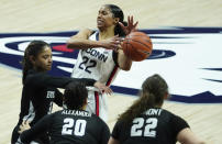 Connecticut guard Evina Westbrook (22) drives against Butler guard Annilia Dawn (3) in the first half of an NCAA college basketball game Tuesday, Jan. 19, 2021, in Storrs, Conn. (David Butler II/Pool Photo via AP)