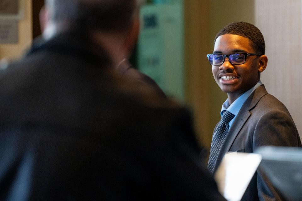 Mar 29, 2024; Teaneck, N.J., United States; Alfred Lewis, 17, is a senior at Teaneck High School and works at the Glenpointe Marriott as part of a paid work-study program. Lewis smiles as he works the front desk.