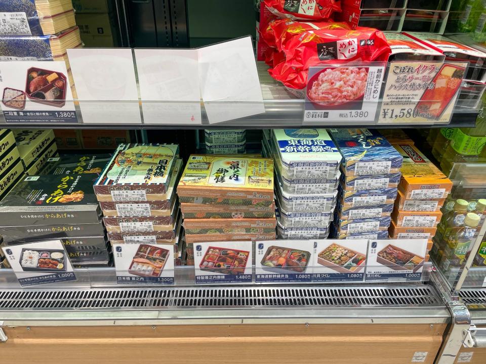 Bento boxes at a food stall in the train station.