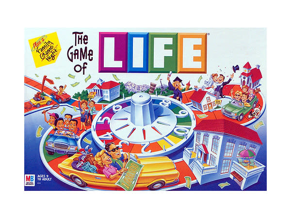 The Game of Life by Milton Bradley. The gameboard & all its