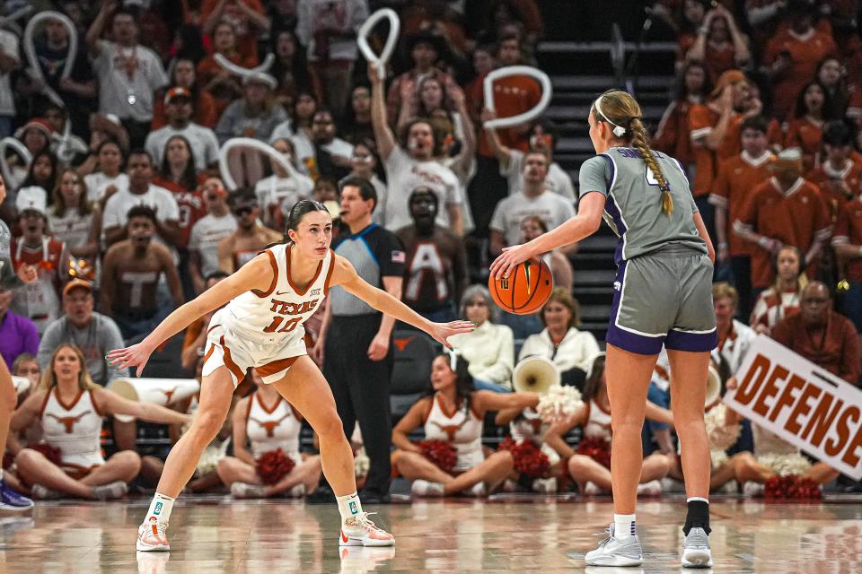 Texas guard Shay Holle guards Kansas State's Serena Sundell during their Feb. 4 game in Austin.  The Longhorns are trying to catch Big 12-leading Oklahoma as the regular season winds down.