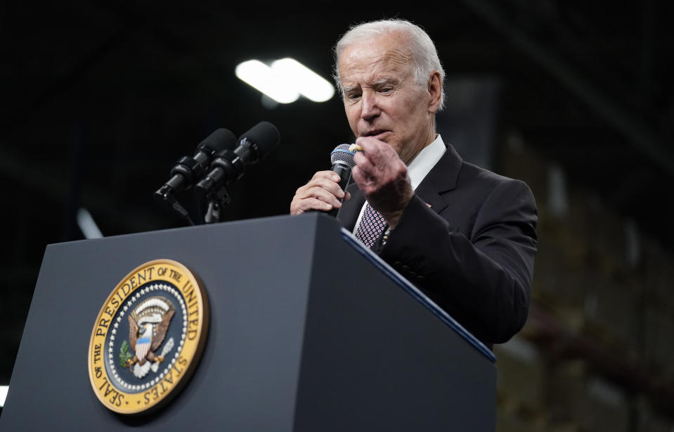 FILE - President Joe Biden looks at a cough drop as he speaks at an IBM facility in Poughkeepsie, N.Y., on Oct. 6, 2022. Whenever the president travels, a special bullet-resistant lectern called the “blue goose,” or its smaller cousin “the falcon,” is in tow. Lately, Biden is rendering them all but obsolete as he increasingly reaches for a hand-held microphone instead. Those who know him best say the mic swap makes Biden a much more natural speaker. (AP Photo/Andrew Harnik, File)