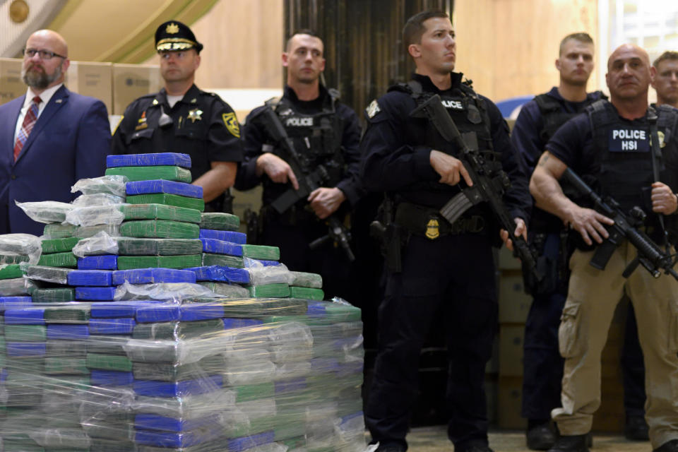 Heavily armed officers stand guard as law enforcement officials present some of the evidence from a cocaine bust on the MSC Gayane in the port of Philadelphia, during a press conference on June 21, 2019.  / Credit: Bastiaan Slabbers/NurPhoto via Getty Images