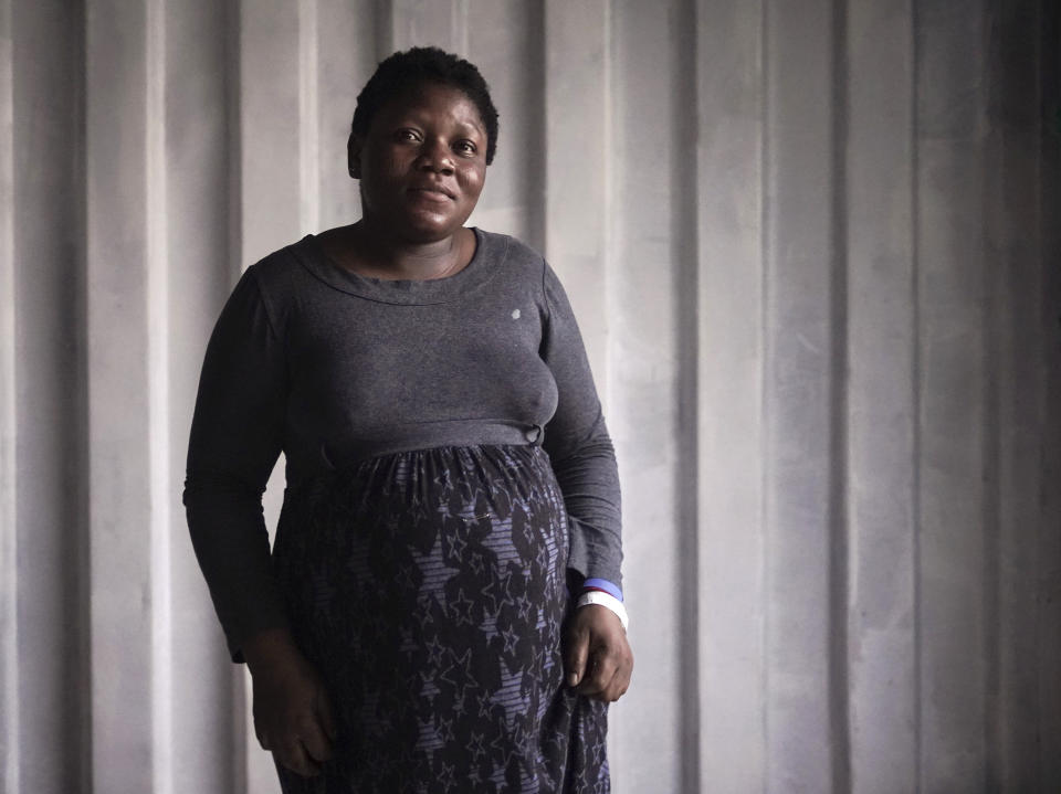 Lillian Nwandalo, 28, from Nigeria, is 8 months pregnant as she poses for a portrait aboard the humanitarian rescue ship Ocean Viking, in Italian waters off the Sicilian town of Messina, southern Italy, Monday, Sept. 23, 2019, hours before disembarking. Lillian traveled alone and doesn’t know what gender her baby is yet but at least he will be born in a peaceful place, she says. (AP Photo/Renata Brito)