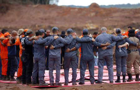 Rescue workers attend a mass for victims of a collapsed tailings dam owned by Brazilian mining company Vale SA, in Brumadinho, Brazil February 1, 2019. REUTERS/Adriano Machado