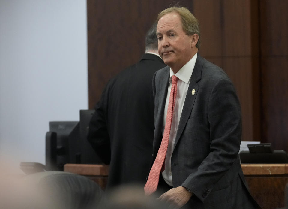 Texas Attorney General Ken Paxton appears at a pretrial hearing in his securities fraud case before state District Judge Andrea Beall in the 185th District Court Tuesday, March 26, 2024 at Harris County Criminal Courts at Law in Houston. Paxton, on Tuesday, agreed to pay nearly $300,000 in restitution under a deal to end criminal securities fraud charges that have shadowed the Republican for nearly a decade. (Yi-Chin Lee/Houston Chronicle via AP)