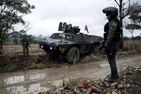 Colombian soldiers stand guard during a military operation at the border with Venezuela in Cucuta, Colombia February 13, 2018. REUTERS/Carlos Eduardo Ramirez