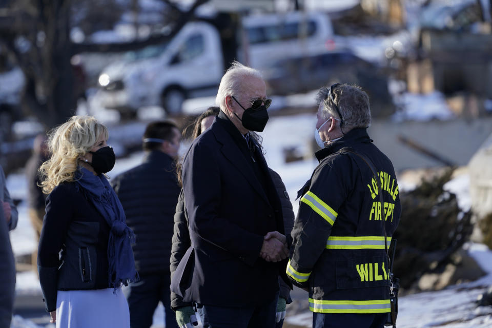 President Joe Biden and first lady Jill Biden tour a neighborhood in Louisville, Colo., Friday, Jan. 7, 2022, that was impacted by the recent wildfire. (AP Photo/Susan Walsh)