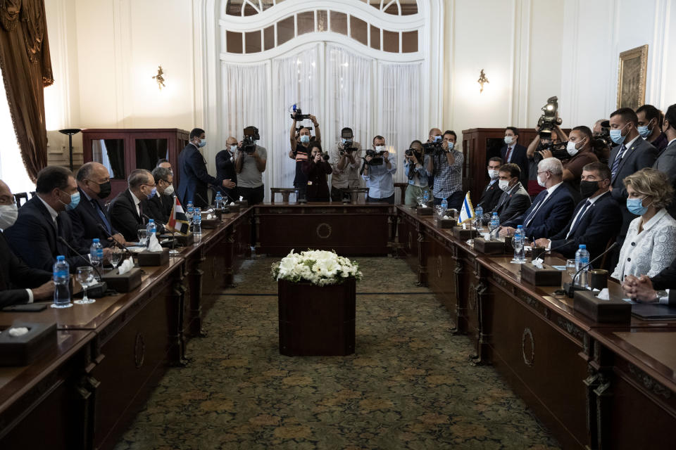 Egyptian Foreign Minister Sameh Shoukry, third from left, meets with Israeli Foreign Minister Gabi Ashkenazi, second from wldright, at the Tahrir Palace in Cairo, Egypt, Sunday, May 30, 2021. (AP Photo/Nariman El-Mofty)