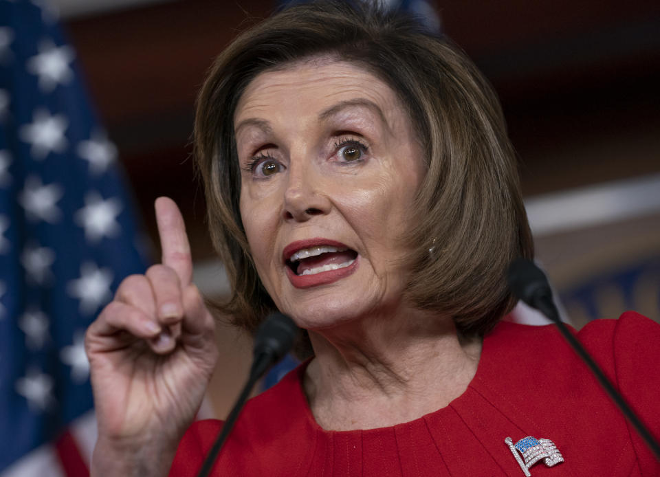 Speaker of the House Nancy Pelosi, D-Calif., talks to reporters on the morning after the first public hearing in the impeachment probe of President Donald Trump on his effort to tie U.S. aid for Ukraine to investigations of his political opponents, on Capitol Hill in Washington, Thursday, Nov. 14, 2019. Pelosi says the president's actions in the impeachment inquiry amount to "bribery." (AP Photo/J. Scott Applewhite)