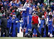 Jan 3, 2016; Orchard Park, NY, USA; Buffalo Bills outside linebacker Manny Lawson (91) celebrates his interception as Buffalo Bills head coach Rex Ryan looks on during the second half against the New York Jets at Ralph Wilson Stadium. Mandatory Credit: Kevin Hoffman-USA TODAY Sports