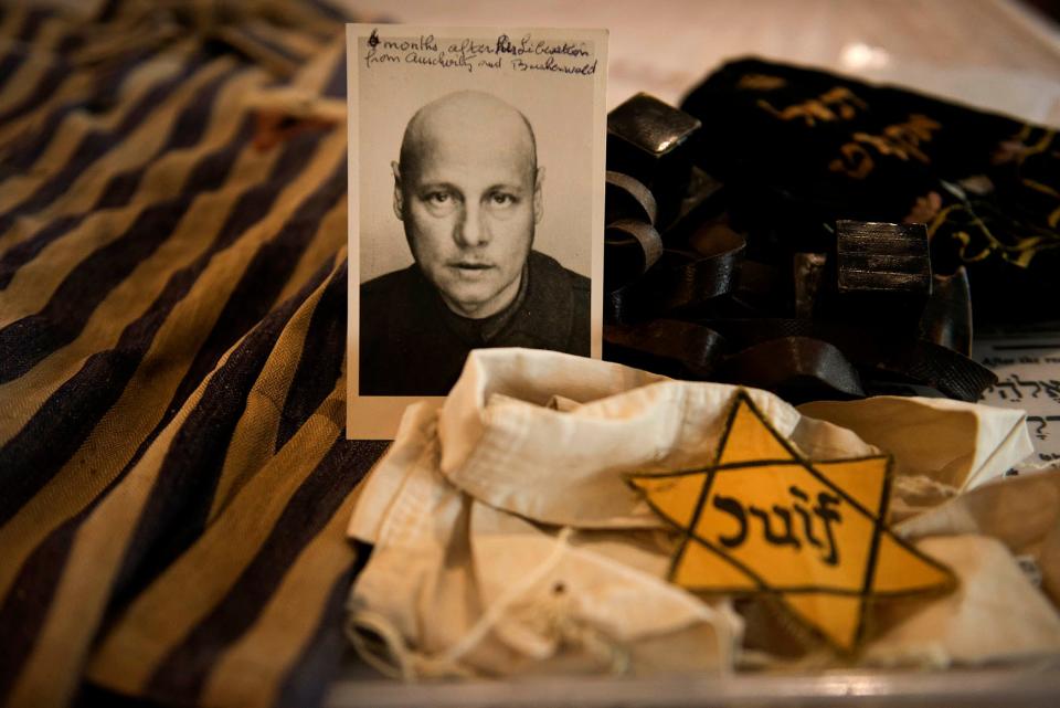 Holocaust survivor Jacqueline Goldman, 95, of Palm Beach, has donated the compulsory yellow badge issued by Nazi officials she wore in France at age 12, her late father Daniel Okrent's concentration camp uniform jacket, his tefillin and a photograph of him taken he after survived the Auschwitz concentration camp, to the Palm Beach Synagogue.