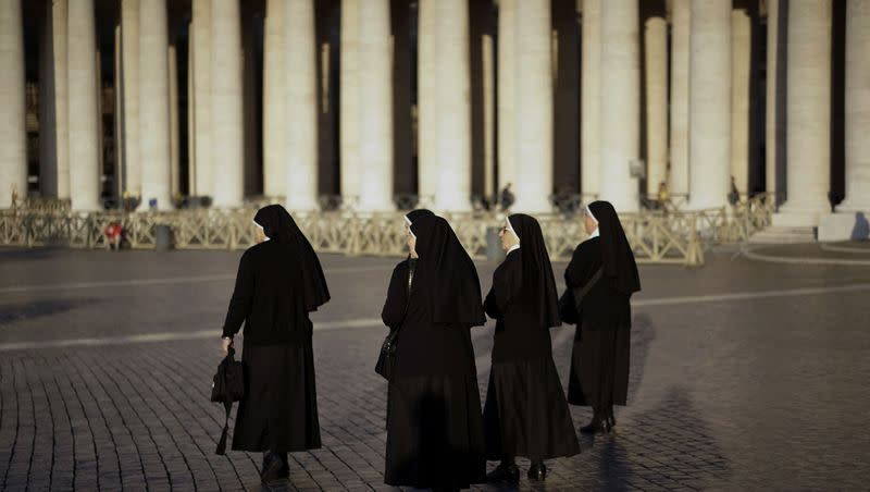 Nuns walk in St. Peter’s Square, at the Vatican, Thursday, Nov. 19, 2015.