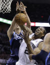 San Antonio Spurs' Kawhi Leonard (2) and Dallas Mavericks' Dirk Nowitzki, left, of Germany, fight for a rebound during the first half of Game 2 of the opening-round NBA basketball playoff series on Wednesday, April 23, 2014, in San Antonio. (AP Photo/Eric Gay)