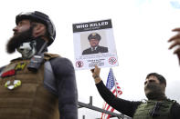 Members of the Proud Boys and other right-wing demonstrators rally on Saturday, Sept. 26, 2020, in Portland, Ore. (AP Photo/Allison Dinner)