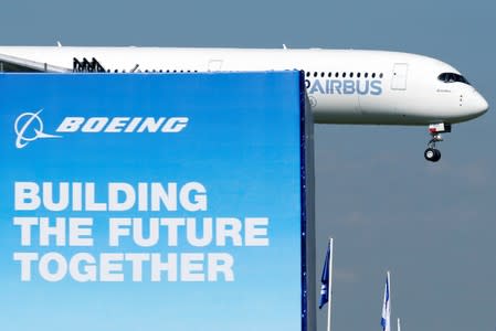 An Airbus A350-1000 performs during the inauguration of the 53rd International Paris Air Show at Le Bourget Airport near Paris